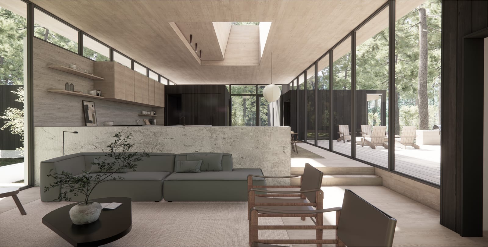 Living room with stone counter and glass walls to the woods